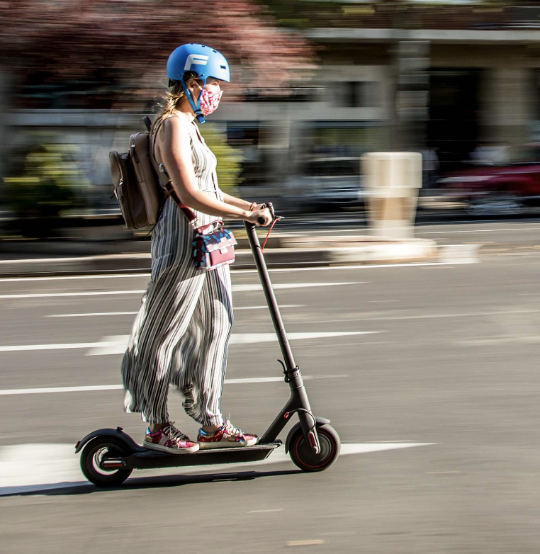 Woman riding an e-scooter